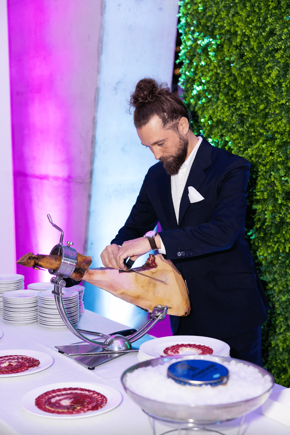 Jamón and melon tableside presentation during Miami celebrity chef event.