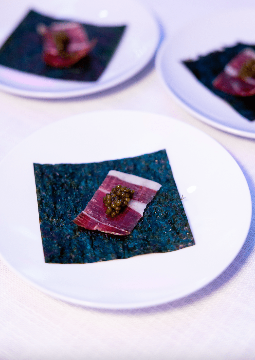 Jamón and melon tableside presentation by José Andrés during Miami celebrity chef event.